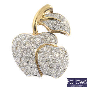 A diamond apple pendant.