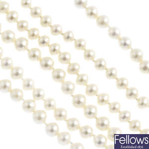 Four cultured pearl single-strand necklaces.