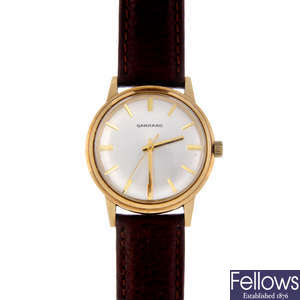 GARRARD - a gentleman's 9ct yellow gold wrist watch.