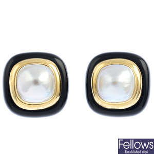A pair of mabe pearl and onyx earrings.
