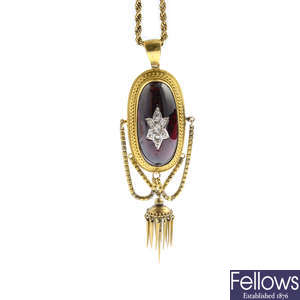 A late Victorian gold garnet and diamond pendant, with chain.
