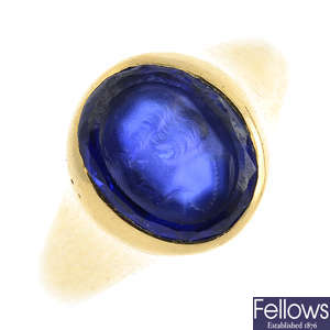 An early 20th century 18ct gold synthetic sapphire signet ring.