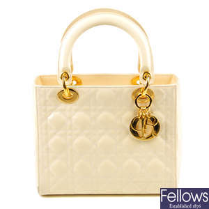 CHRISTIAN DIOR - a patent cream Cannage Lady Dior MM handbag.