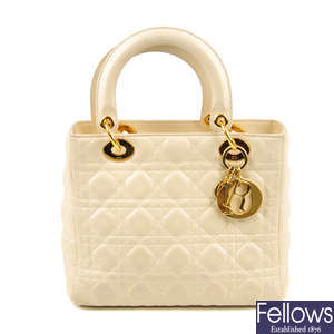 CHRISTIAN DIOR - a cream Cannage Lady Dior MM handbag.