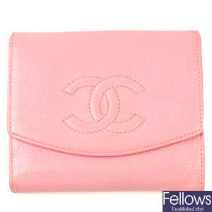 CHANEL - a pink square Caviar wallet.