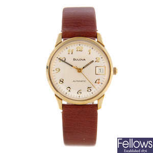 BULOVA - a gentleman's gold plated wrist watch with two Bulova watches.