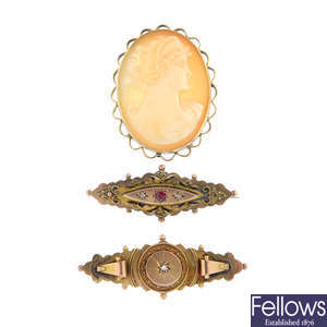 Four diamond and gem-set brooches.