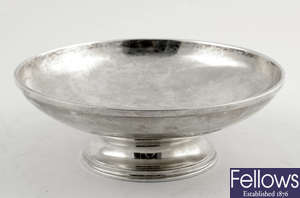A modern plain silver footed dish of circular form.