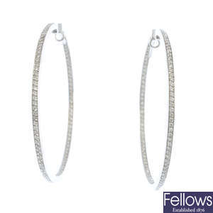 A pair of diamond front facing ear hoops.