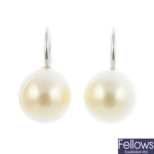 A pair of cultured pearl earrings.