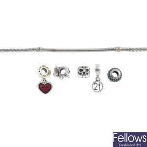 PANDORA - a bracelet, five charms, with fourteen non-designer charms.