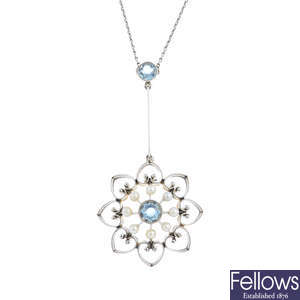 An Edwardian 15ct gold and platinum, aquamarine and seed pearl pendant, with chain.