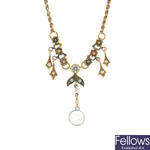 An early 20th century gold moonstone, diamond, split pearl and seed pearl necklace.