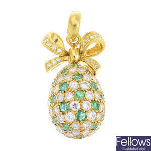 A diamond and emerald egg pendant.