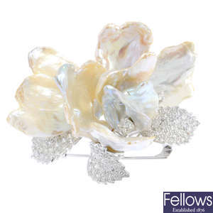 A diamond and cultured pearl flower brooch.