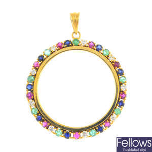 A diamond, ruby, sapphire and emerald pendant coin mount.