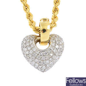 An 18ct gold diamond pendant, with a chain.
