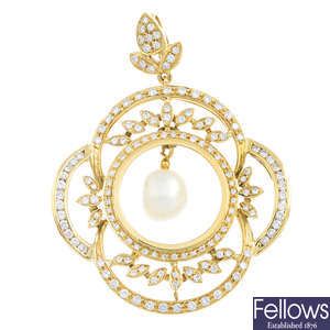 A diamond and cultured pearl pendant.