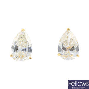 A pair of pear-shape diamond stud earrings, of 1.82 and 1.80cts respectively.