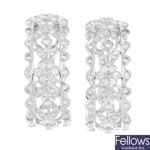 ADLER - a pair of diamond floral earrings.