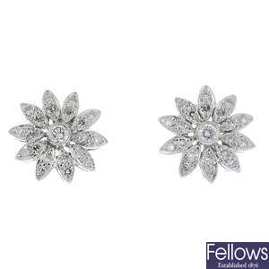 A pair of 18ct gold diamond floral earrings.