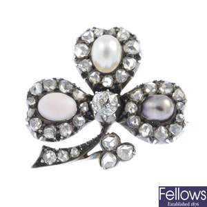 A late Victorian silver and gold, pearl and conch pearl shamrock brooch.