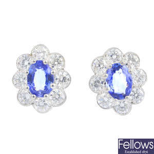 A pair of sapphire and diamond floral cluster earrings.