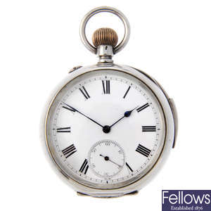 A white metal open face repeater pocket watch.