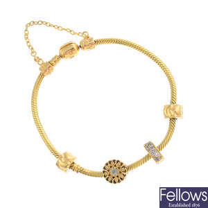 PANDORA - a 14ct gold bracelet.
