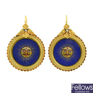 A pair of hand painted Asian gold earrings.