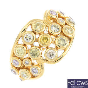 An 18ct gold diamond and coloured diamond dress ring.