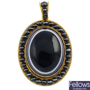 A mid  Victorian gold plated banded agate locket.
