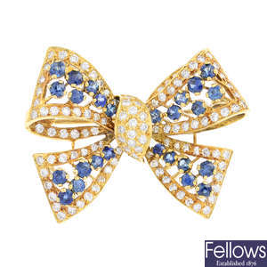 An 18ct gold sapphire and diamond bow brooch.