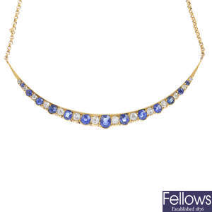 A converted early 20th century gold sapphire and diamond crescent necklace, with later 9ct gold chain.