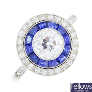 An Art Deco platinum diamond and sapphire cluster ring.
