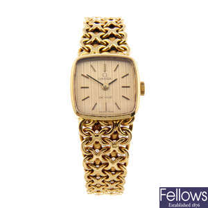 OMEGA - a lady's 18ct yellow gold De Ville bracelet watch.