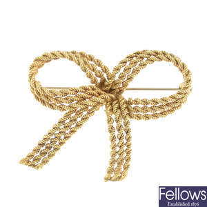 CARTIER - a mid 20th century bow brooch.