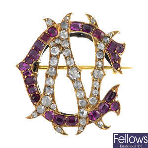 A late Victorian gold diamond and ruby monogram brooch.