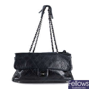 CHANEL - a black Quilted Ritz Flap handbag.