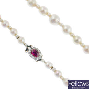 An early 20th century cultured pearl single-strand necklace, with ruby and diamond clasp.