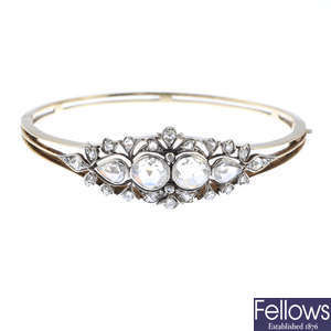 An Edwardian gold and silver, diamond hinged bangle.