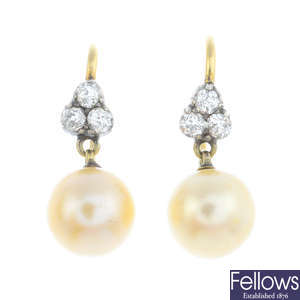 A pair of natural pearl and diamond earrings.