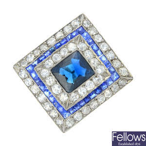 A mid 20th century, platinum sapphire and diamond cluster ring.