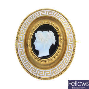 A late Victorian onyx cameo and enamel brooch.