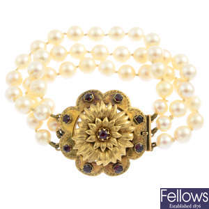 A cultured pearl bracelet, with a Victorian gold and garnet clasp.