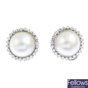 A pair of mabe pearl and diamond cluster earrings.