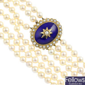A cultured pearl three-row necklace, with 9ct gold split pearl and enamel clasp.