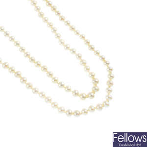 Two cultured pearl single-strand necklaces.