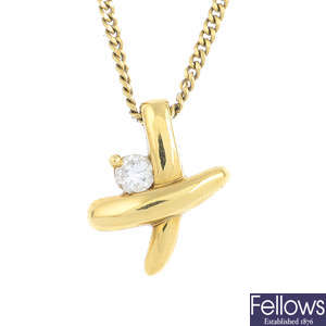 A 18ct gold diamond pendant, with an 18ct gold chain.