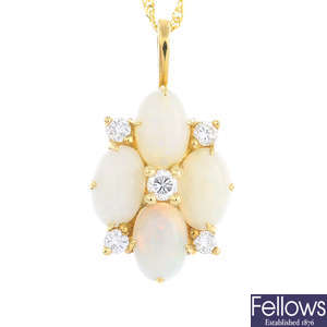 An 18ct gold opal and diamond cluster pendant, with a chain.